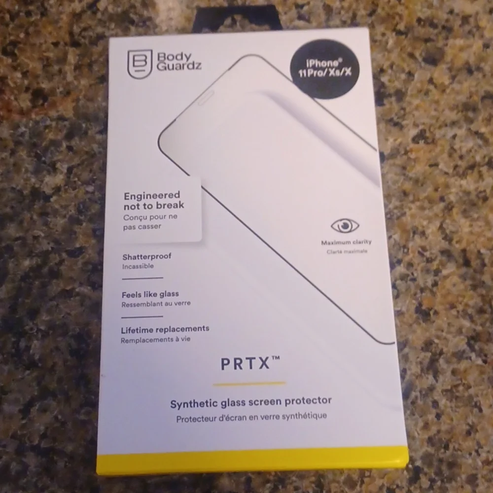 IPhone synthetic glass screen protector. Unopened box, never used, $50 value.